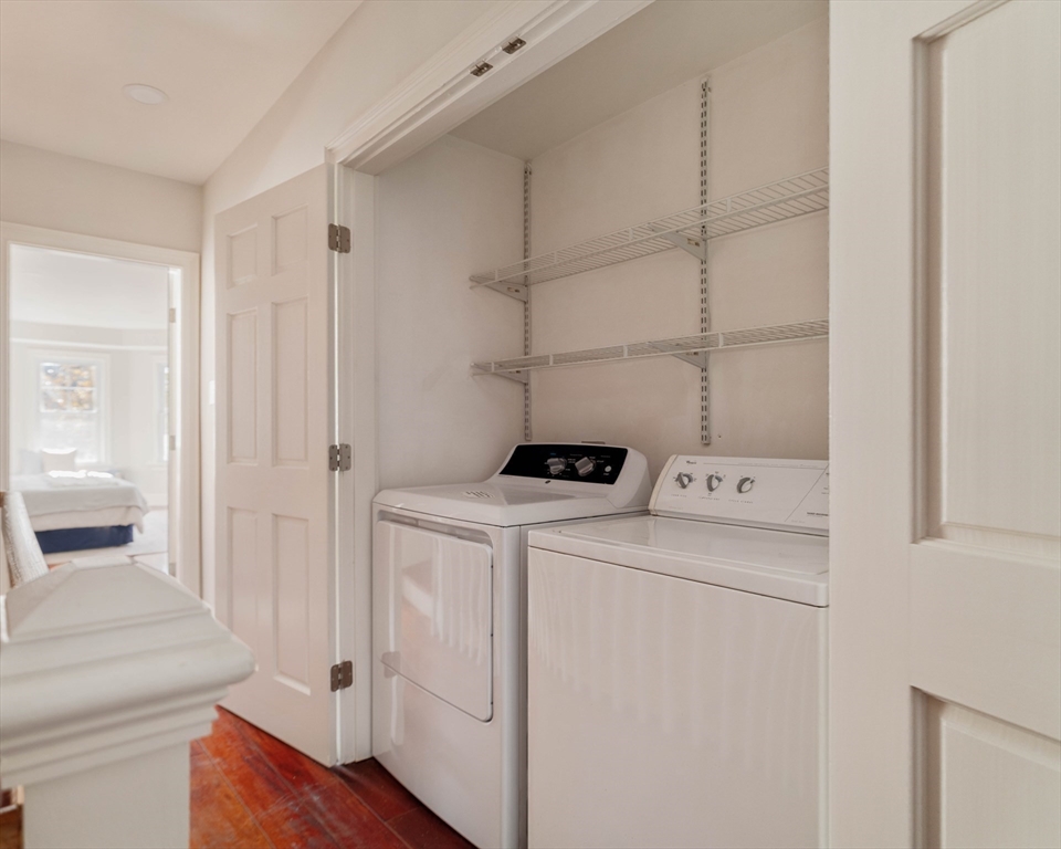 32 Hall Avenue, Unit 32 Somerville, MA 02144 - Photo 20 of 30 a view of storage and utility room with washer and dryer