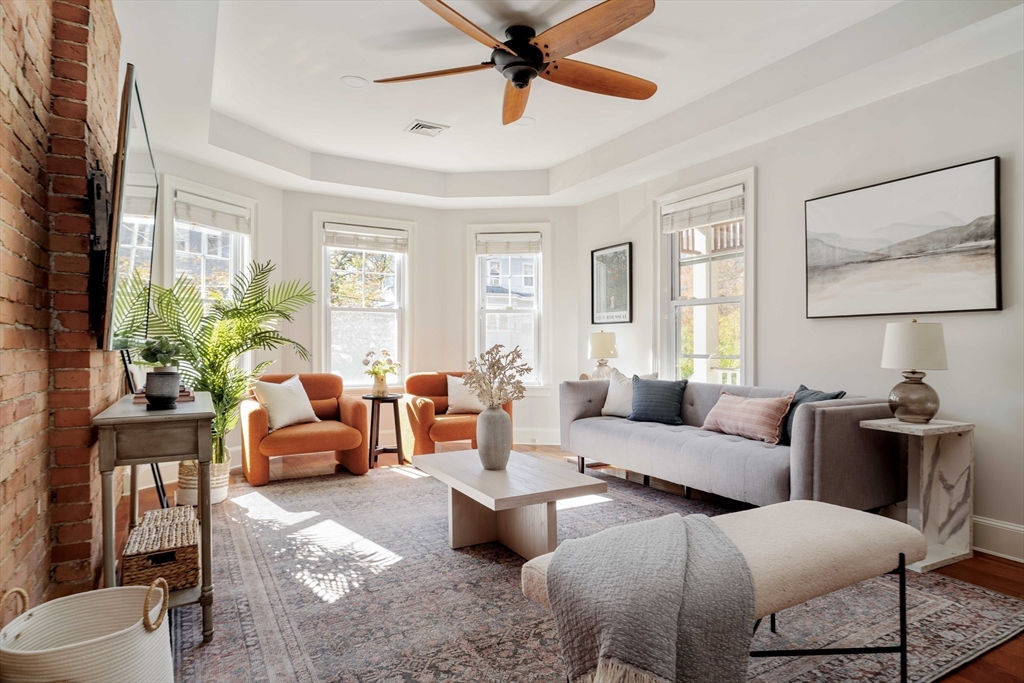 32 Hall Avenue, Unit 32 Somerville, MA 02144 - Photo 2 of 30 a living room with furniture and a large window