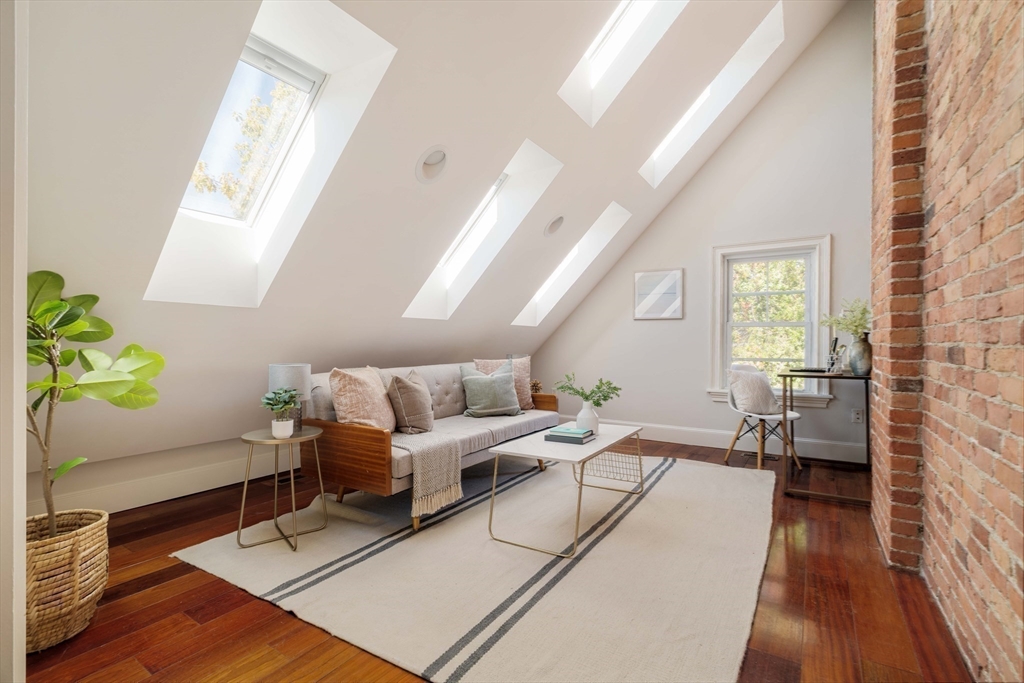 32 Hall Avenue, Unit 32 Somerville, MA 02144 - Photo 22 of 30 a living room with furniture and a wooden floor