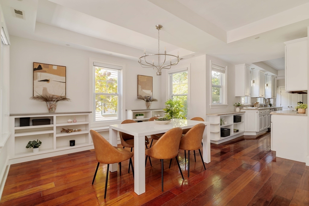 32 Hall Avenue, Unit 32 Somerville, MA 02144 - Photo 3 of 30 a view of a dining room with furniture window and wooden floor