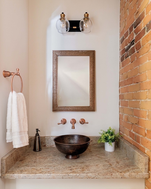 32 Hall Avenue, Unit 32 Somerville, MA 02144 - Photo 4 of 30 a bathroom with a sink and a mirror