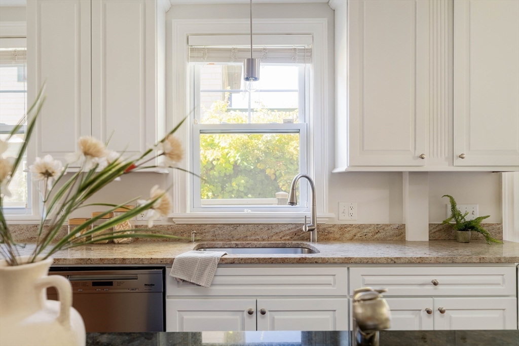 32 Hall Avenue, Unit 32 Somerville, MA 02144 - Photo 8 of 30 a kitchen with a sink and a window