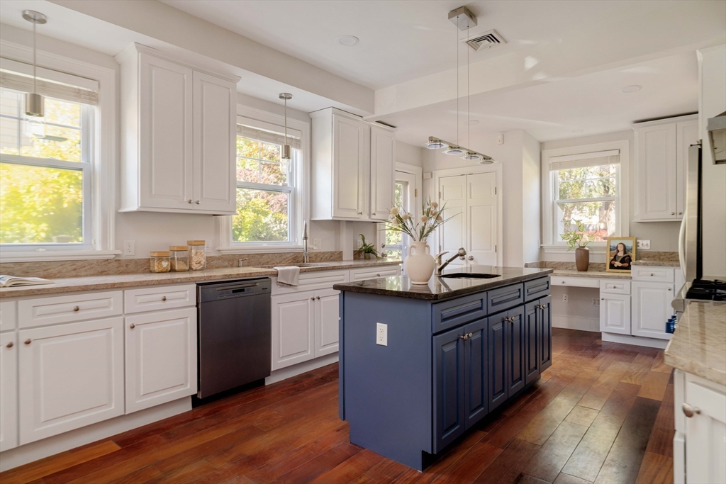 32 Hall Avenue, Unit 32 Somerville, MA 02144 - Photo 9 of 30 a kitchen with granite countertop a sink stove and cabinets