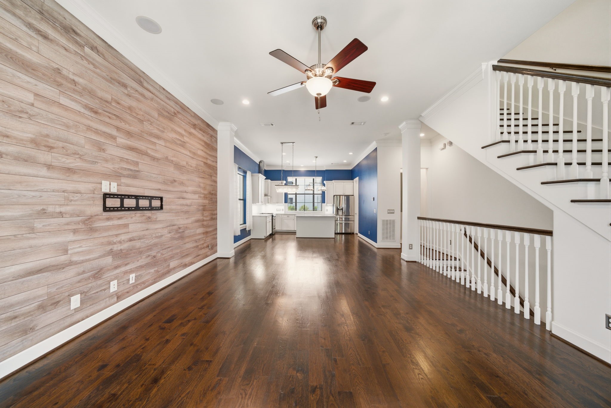 911 West Drew Street Houston, TX 77006 - Photo 11 of 44 a view of an empty room with wooden floor and a ceiling fan