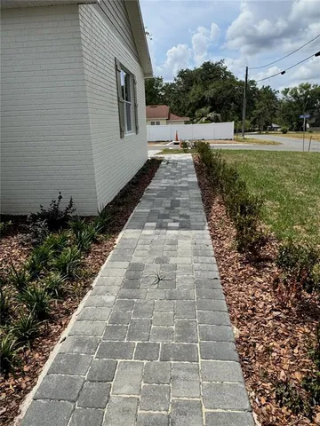 a kitchen with a sink two cabinets and a couch