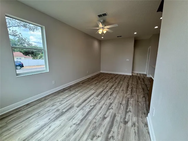 a bathroom with double vanity and a mirror