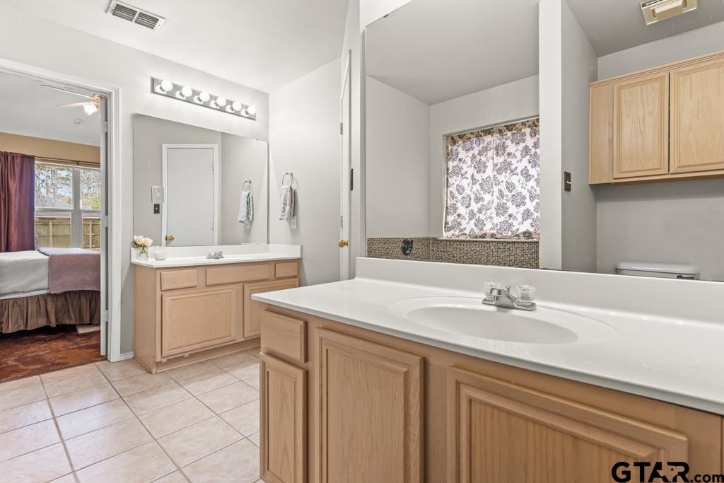 270 Frederick Circle Flint, TX 75762 - Photo 17 of 34 a bathroom with a sink double vanity and a mirror
