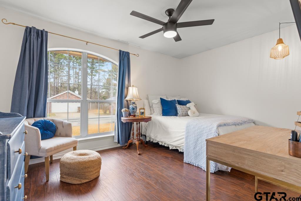 270 Frederick Circle Flint, TX 75762 - Photo 20 of 34 a bedroom with a bed and wooden floor
