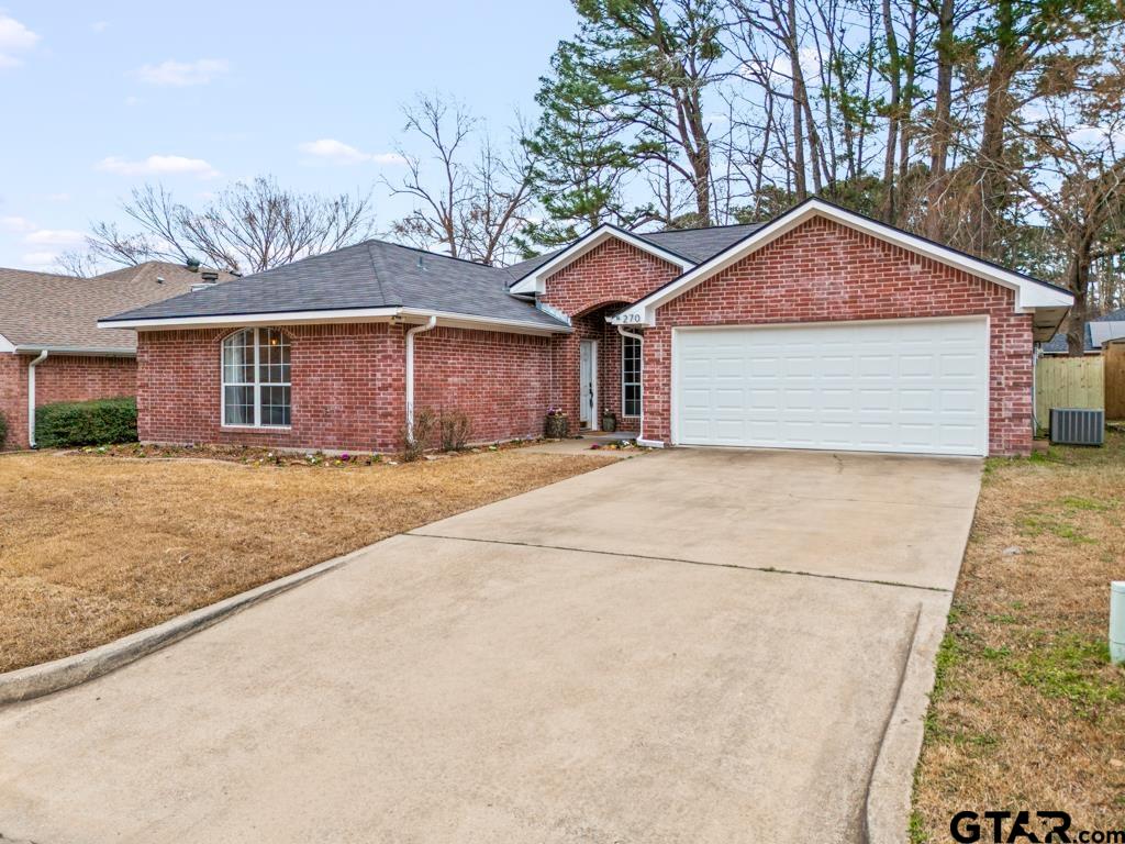 270 Frederick Circle Flint, TX 75762 - Photo 2 of 34 a front view of a house with a yard and garage