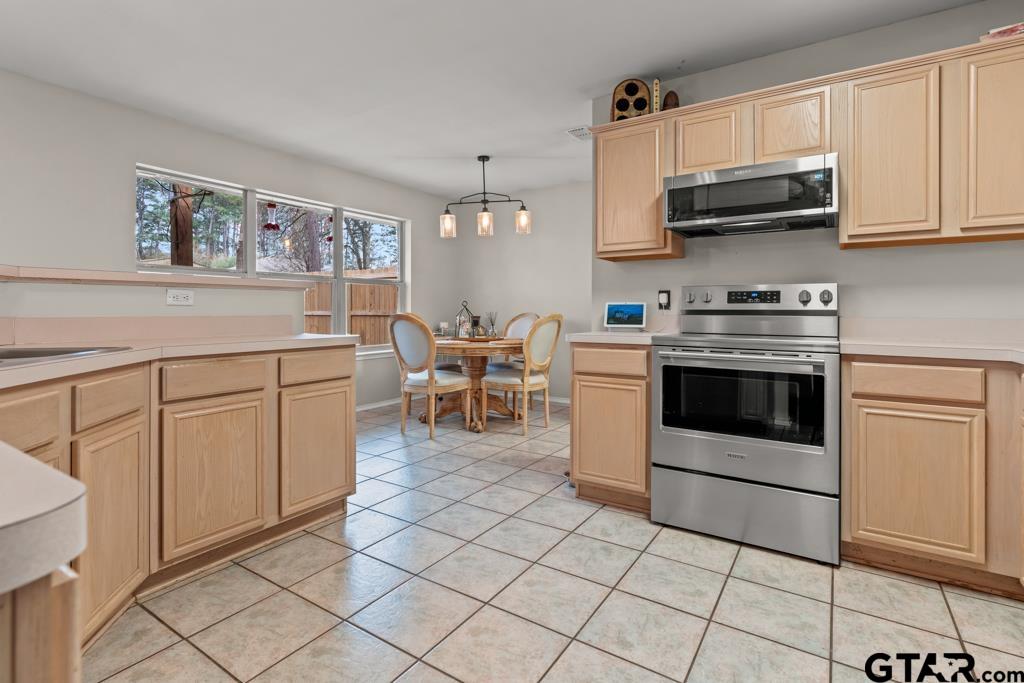 270 Frederick Circle Flint, TX 75762 - Photo 10 of 34 a kitchen with stainless steel appliances granite countertop a stove a sink and a microwave