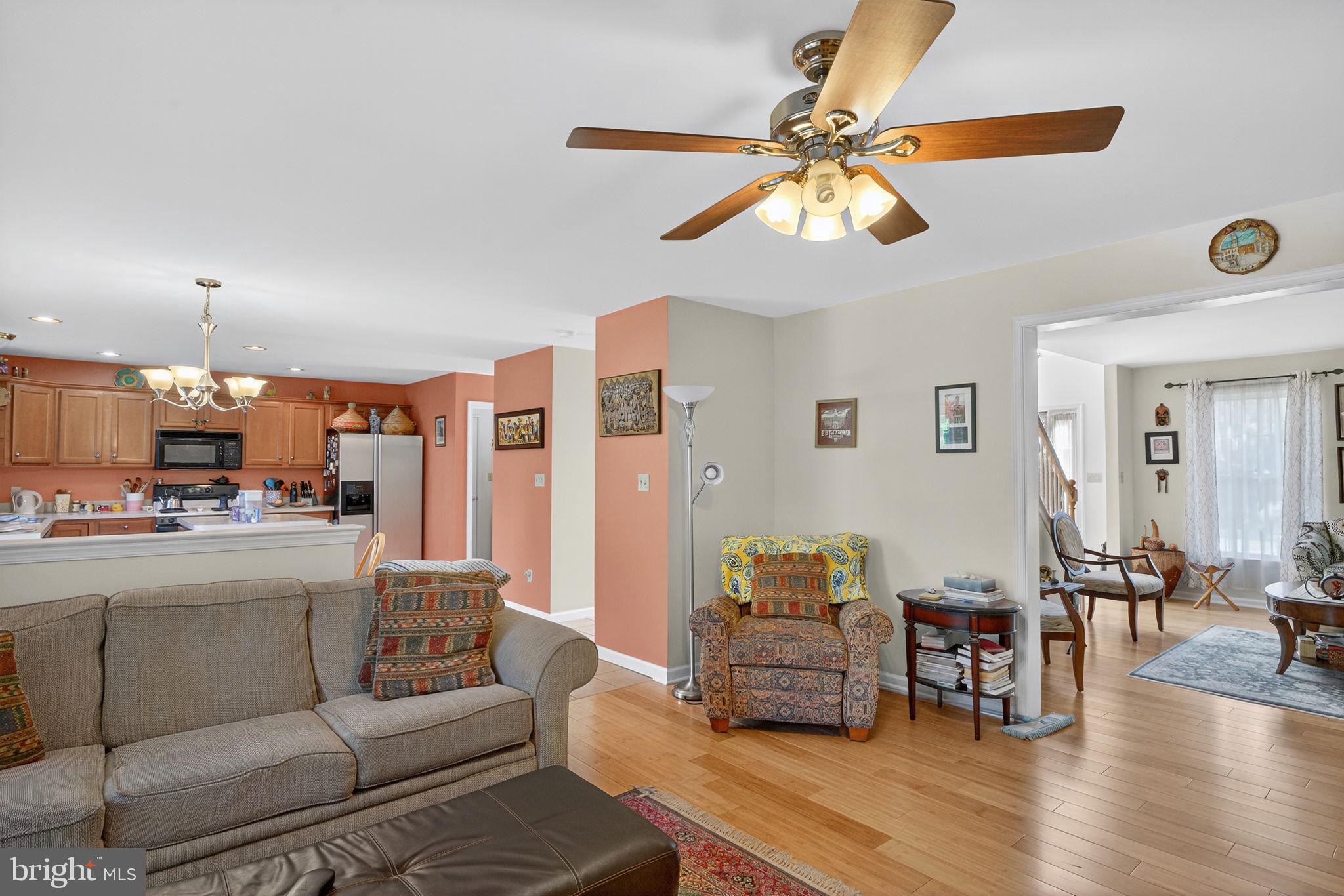 6779 Hickory Road Macungie, PA 18062 - Photo 17 of 51 a living room with furniture kitchen view and a chandelier