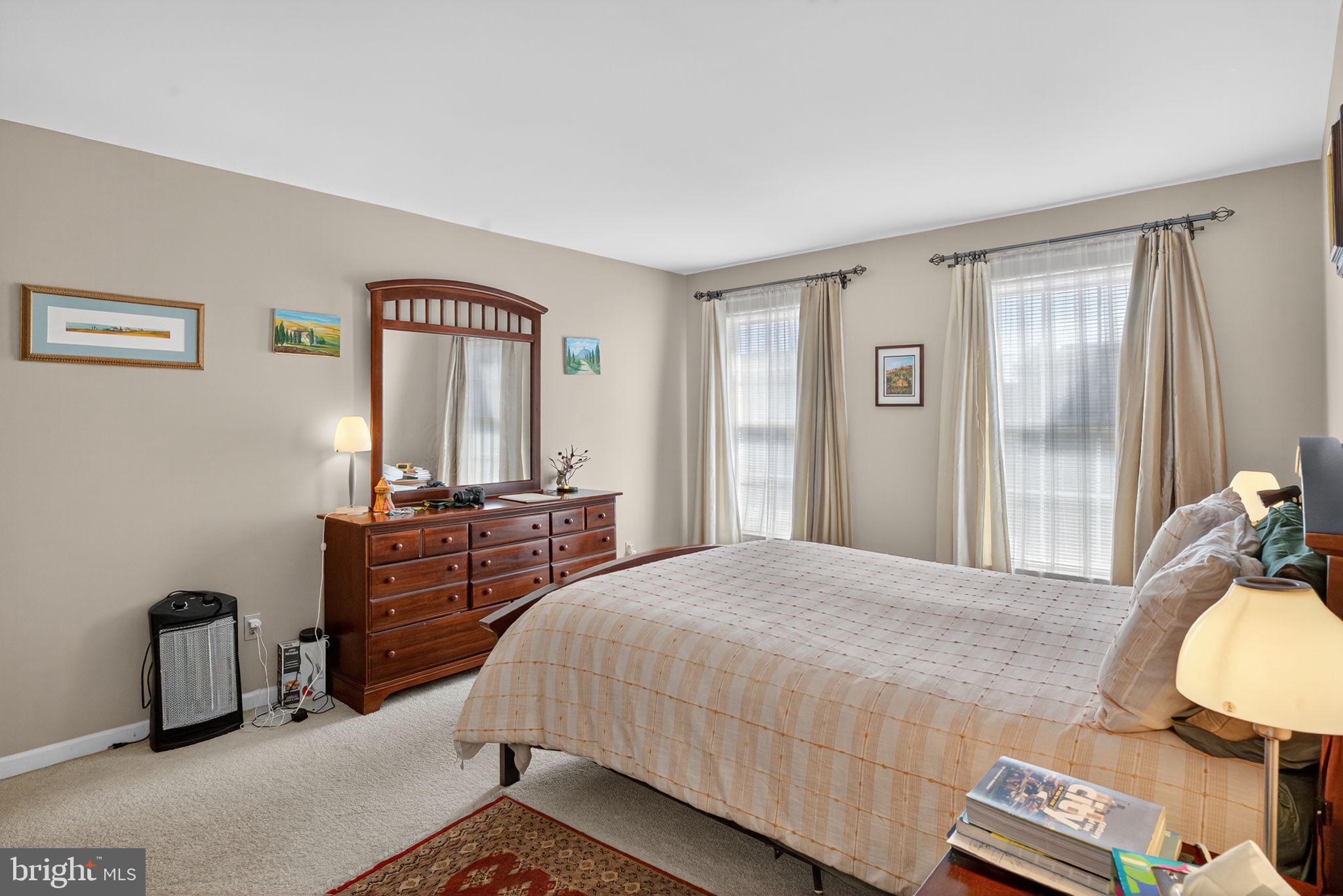 6779 Hickory Road Macungie, PA 18062 - Photo 26 of 51 a bedroom with a bed and a dresser