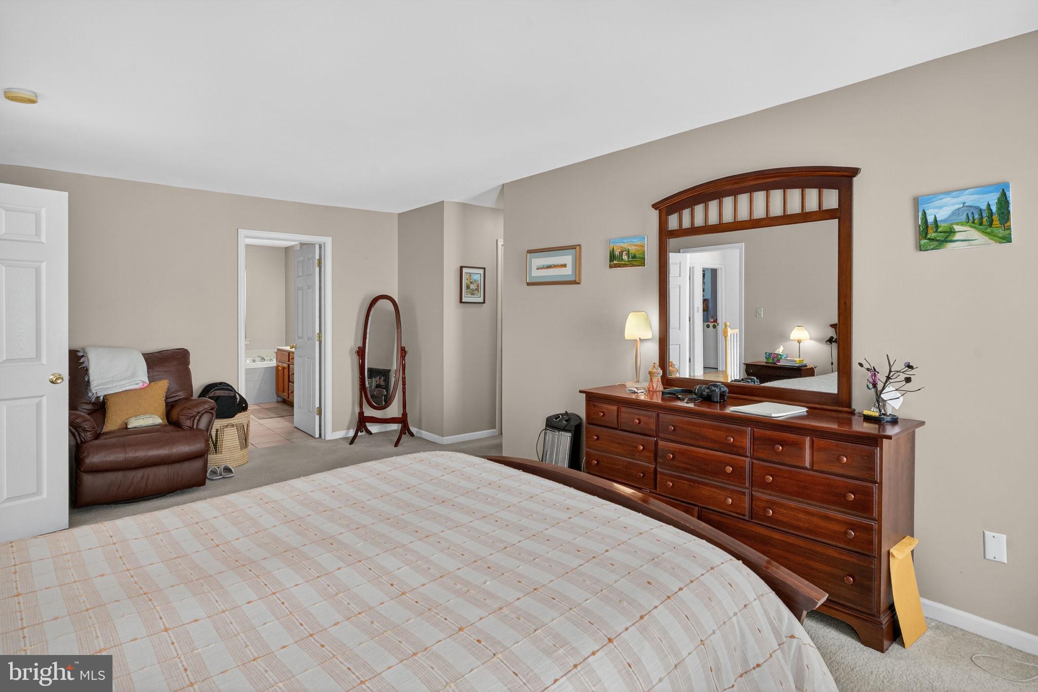 6779 Hickory Road Macungie, PA 18062 - Photo 30 of 51 a bedroom with a bed and a large mirror