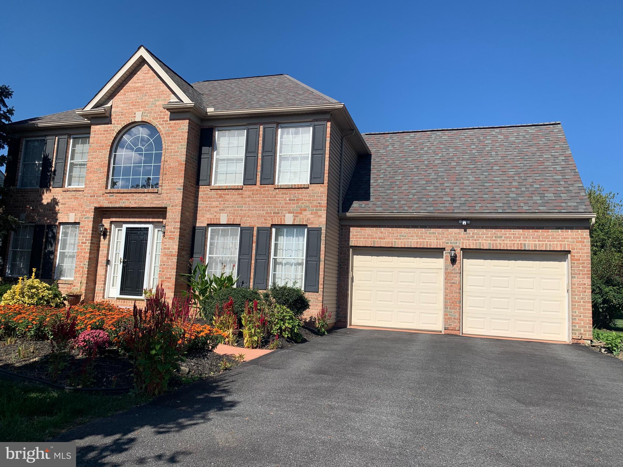 6779 Hickory Road Macungie, PA 18062 - Photo 3 of 51 a front view of a house with a yard and garage