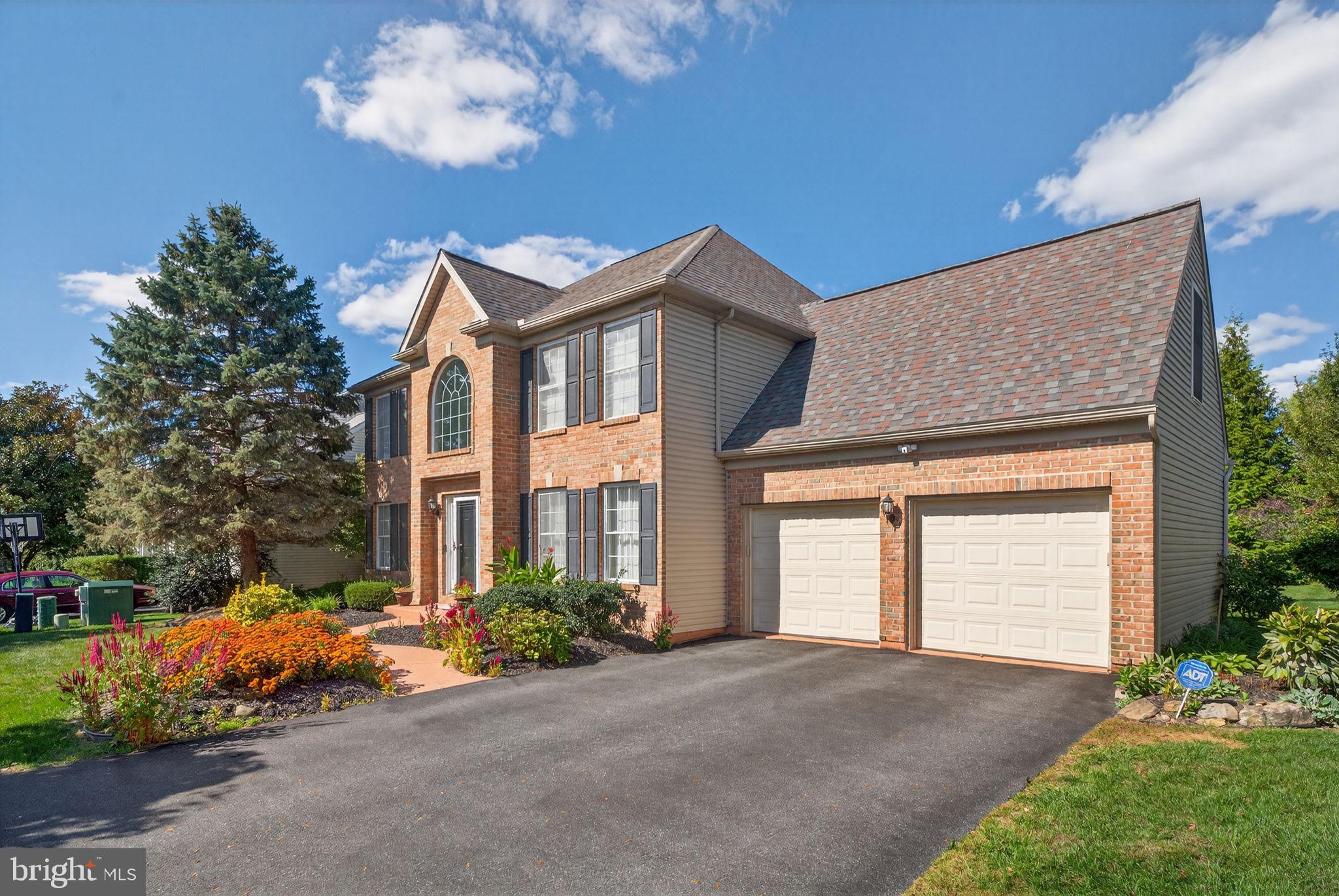 6779 Hickory Road Macungie, PA 18062 - Photo 4 of 51 a front view of a house with a yard and garage
