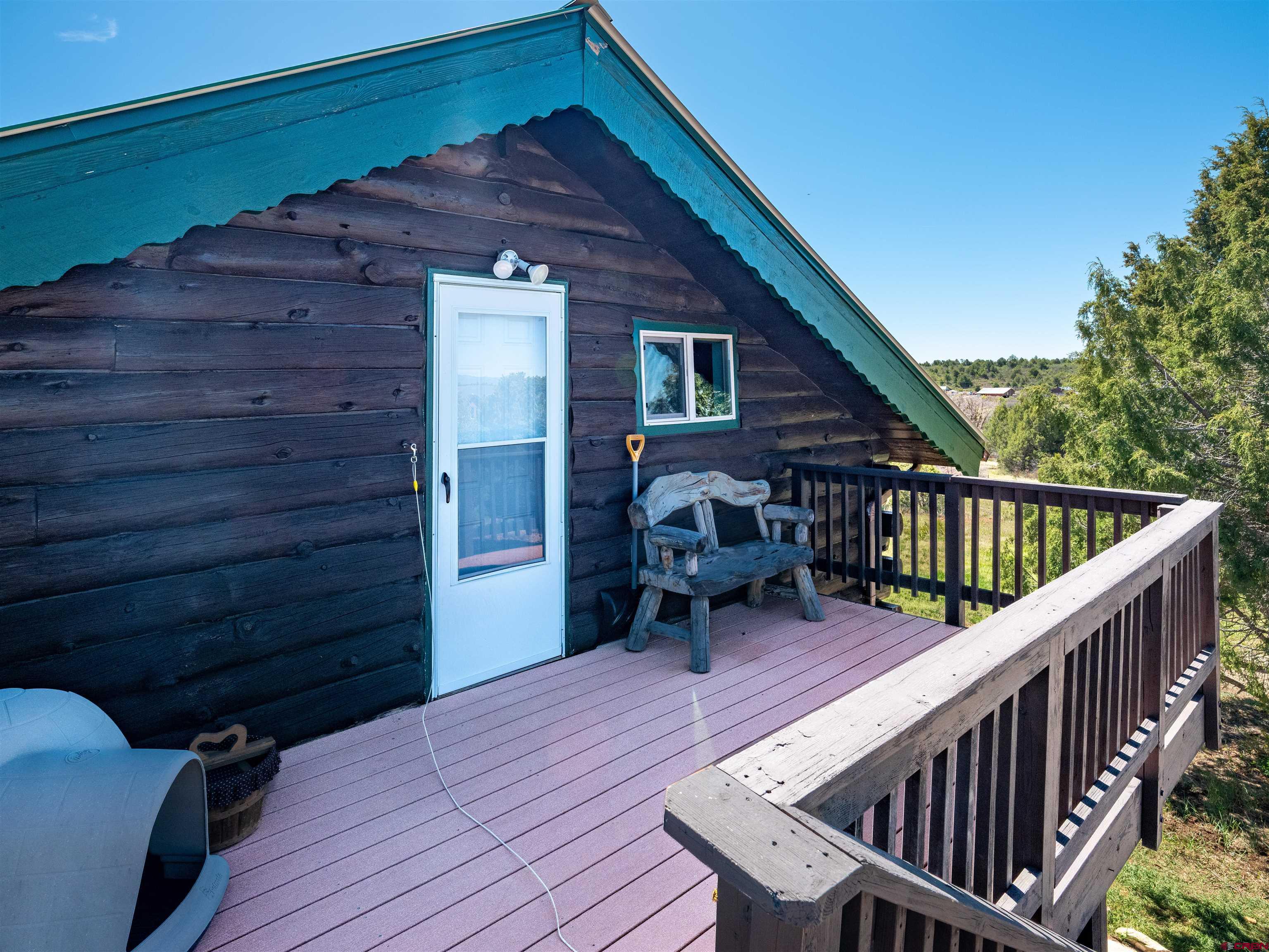 36859 Rd P.2 Mancos, CO 81328 - Photo 19 of 28 a balcony with wooden floor outdoor seating and stairs
