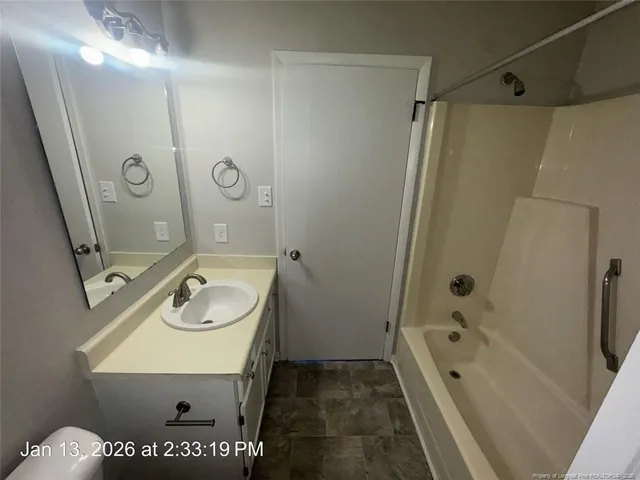 a view of swimming pool with seating space