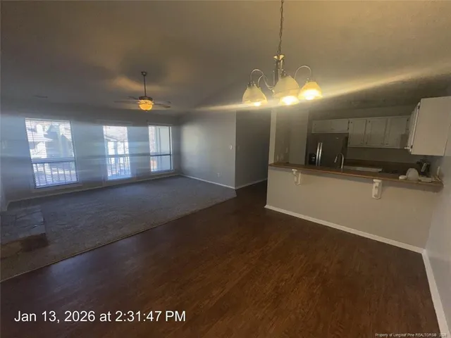 a kitchen with stainless steel appliances granite countertop a stove a refrigerator and a sink