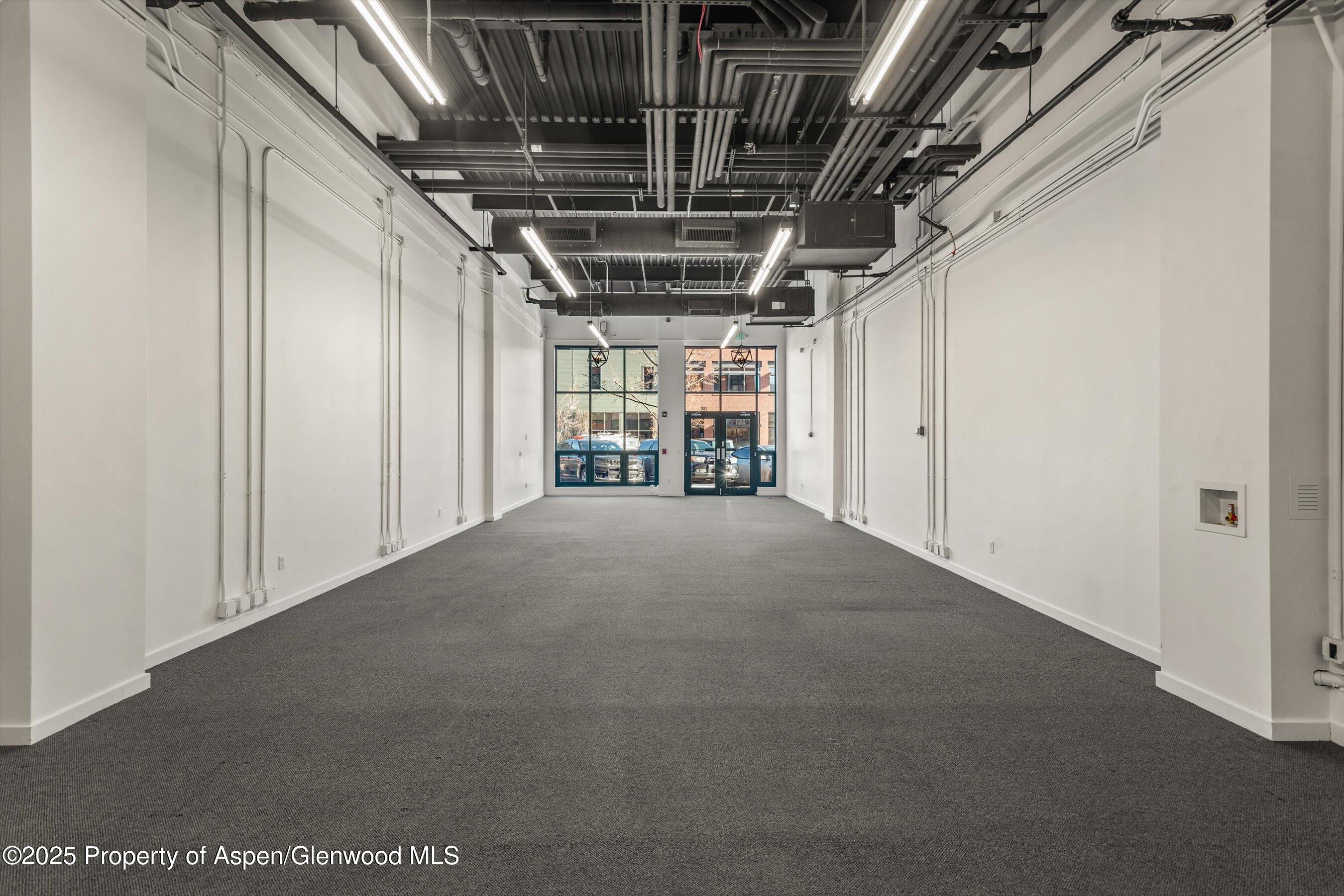 780 East Valley Road, Unit C126 Basalt, CO 81621 - Photo 3 of 9 a view of empty room with wooden walls