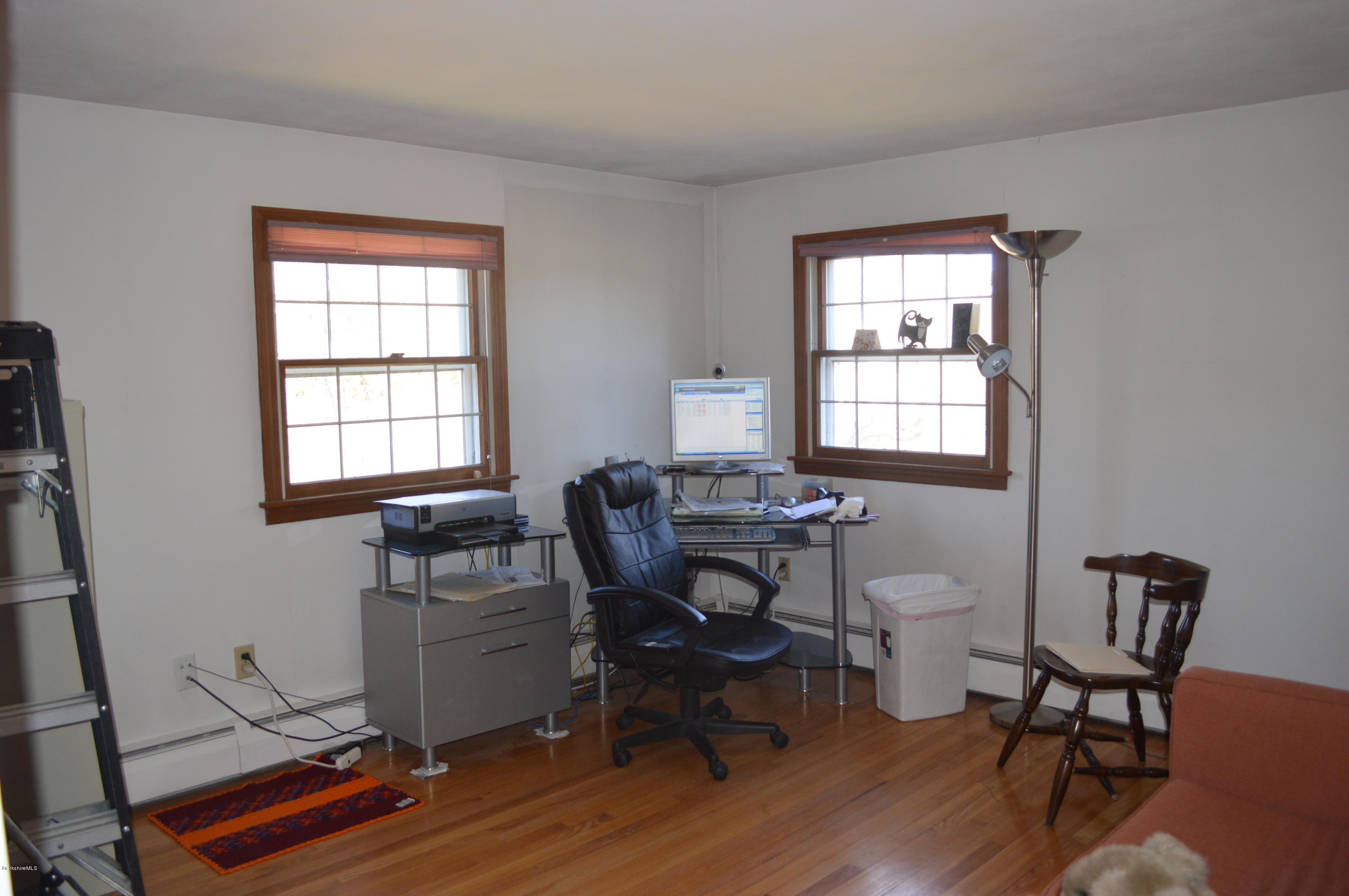 485 Devon Road Lee, MA 01238 - Photo 11 of 28 a work room with furniture a piano and wooden floor