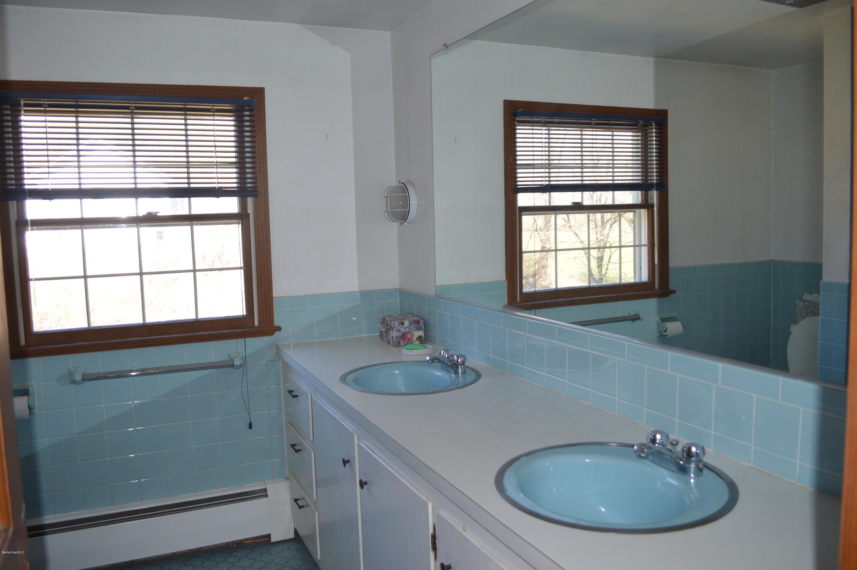 485 Devon Road Lee, MA 01238 - Photo 12 of 28 a bathroom with a sink and a window