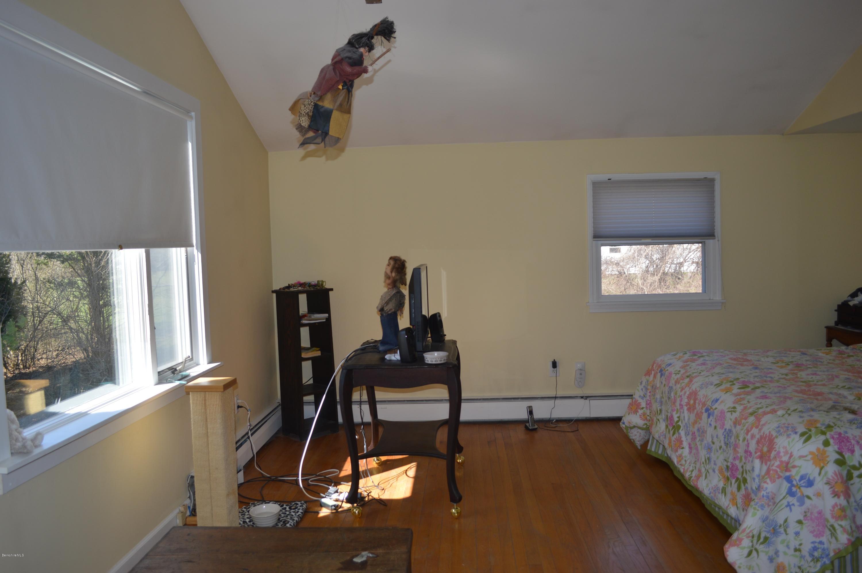 485 Devon Road Lee, MA 01238 - Photo 14 of 28 a bedroom with bed and a window