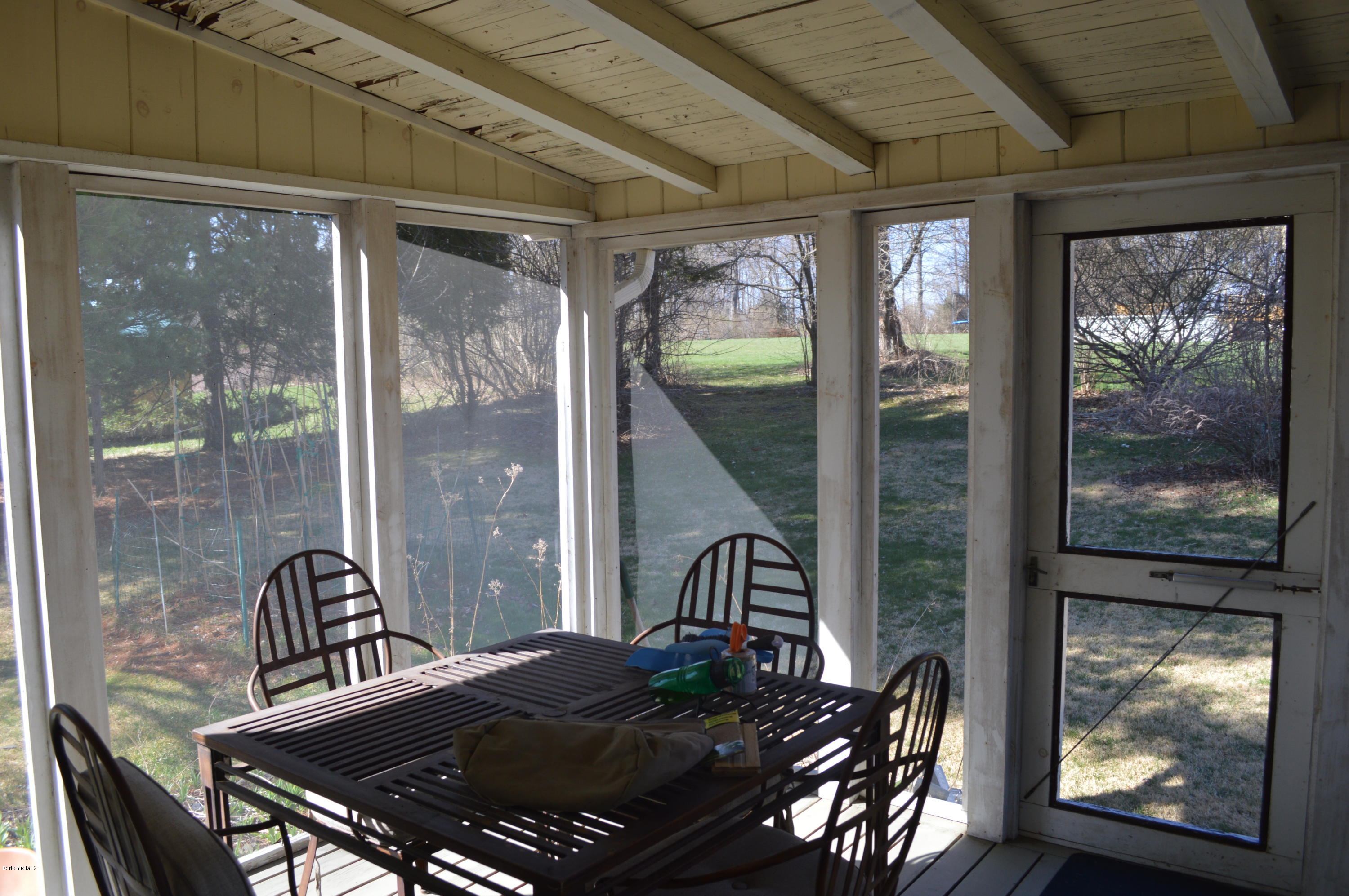 485 Devon Road Lee, MA 01238 - Photo 15 of 28 a view of a balcony dining table and chairs