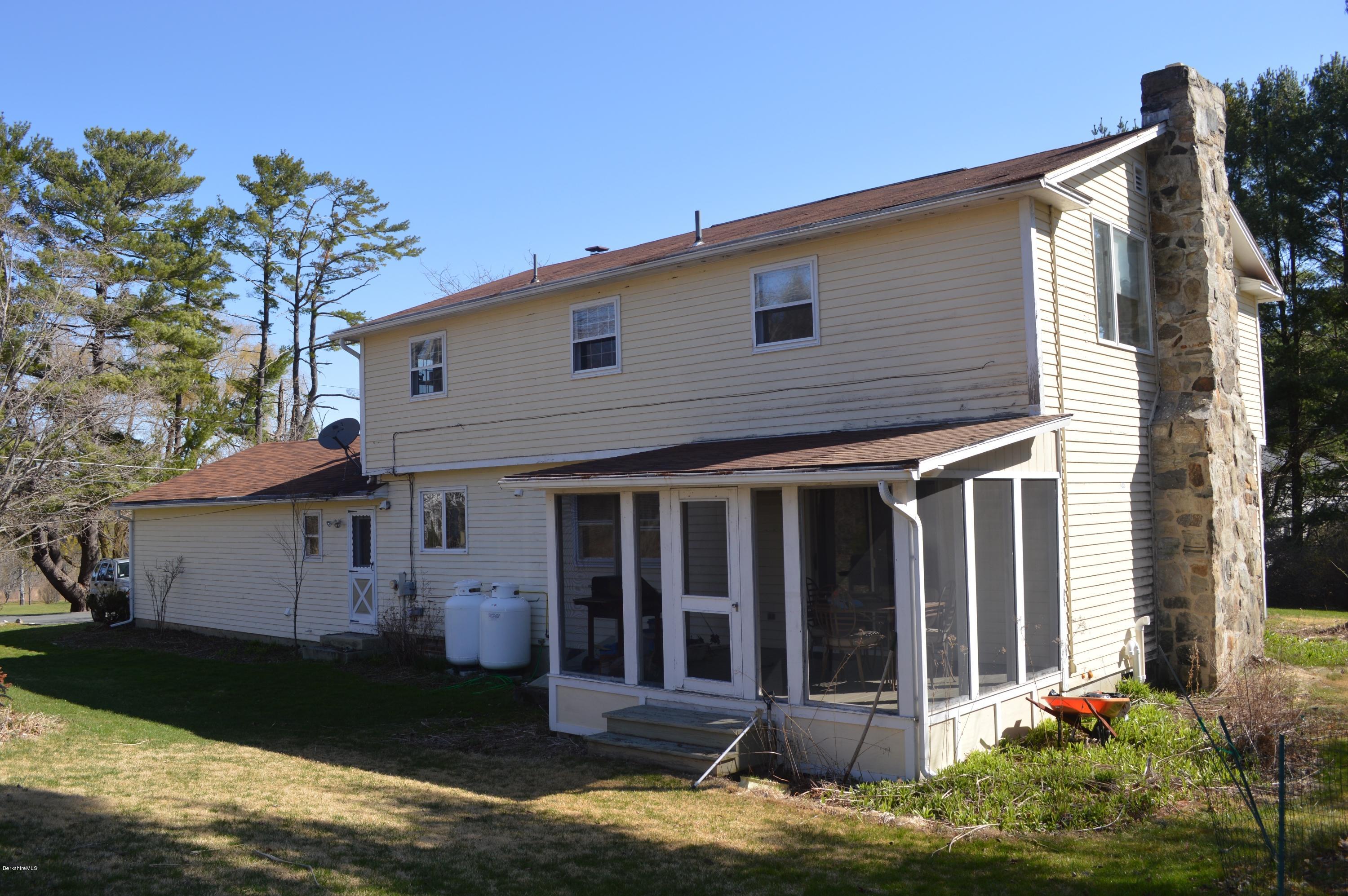 485 Devon Road Lee, MA 01238 - Photo 19 of 28 a front view of a house with a garden