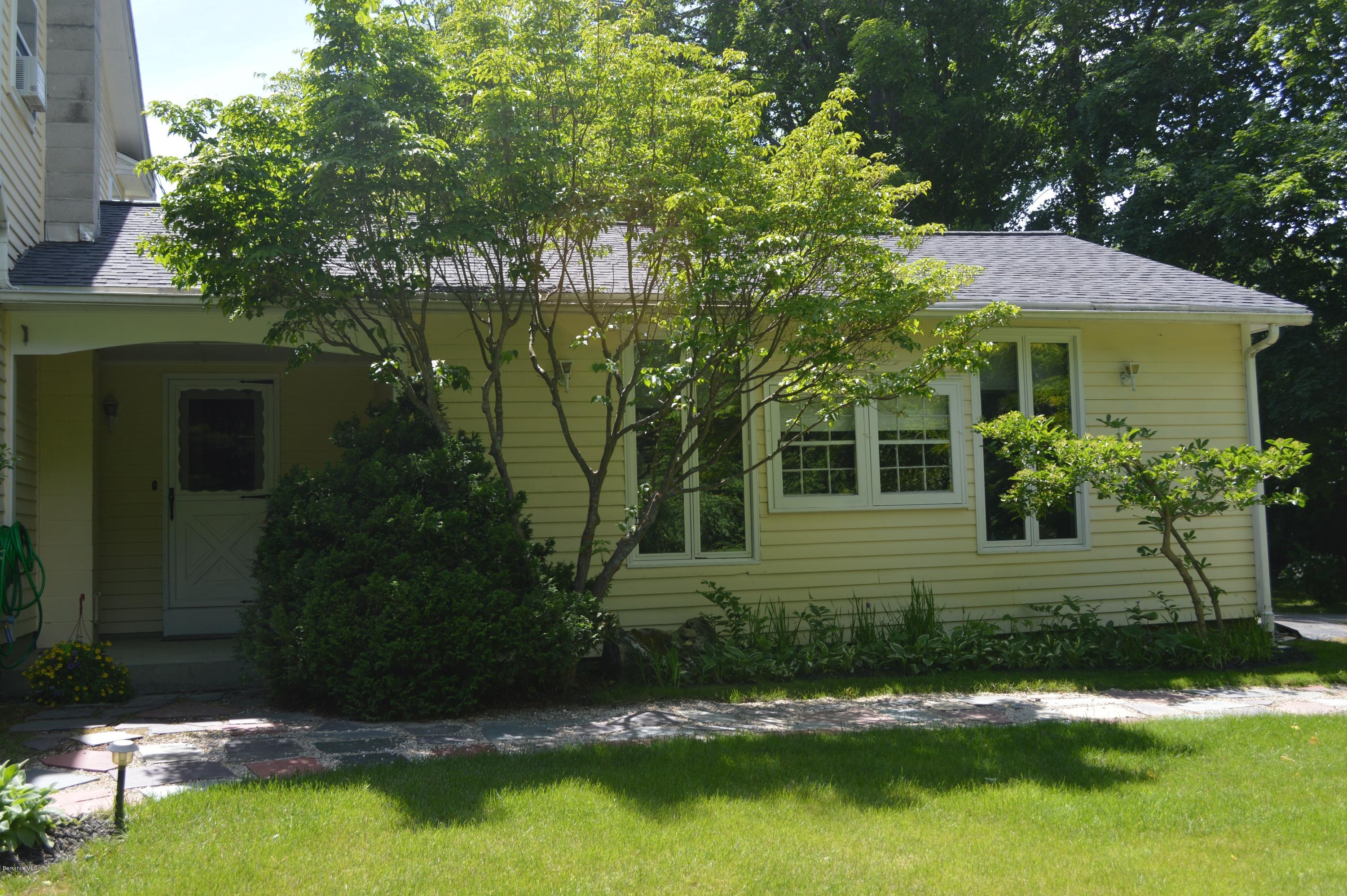 485 Devon Road Lee, MA 01238 - Photo 22 of 28 a view of a house with a yard