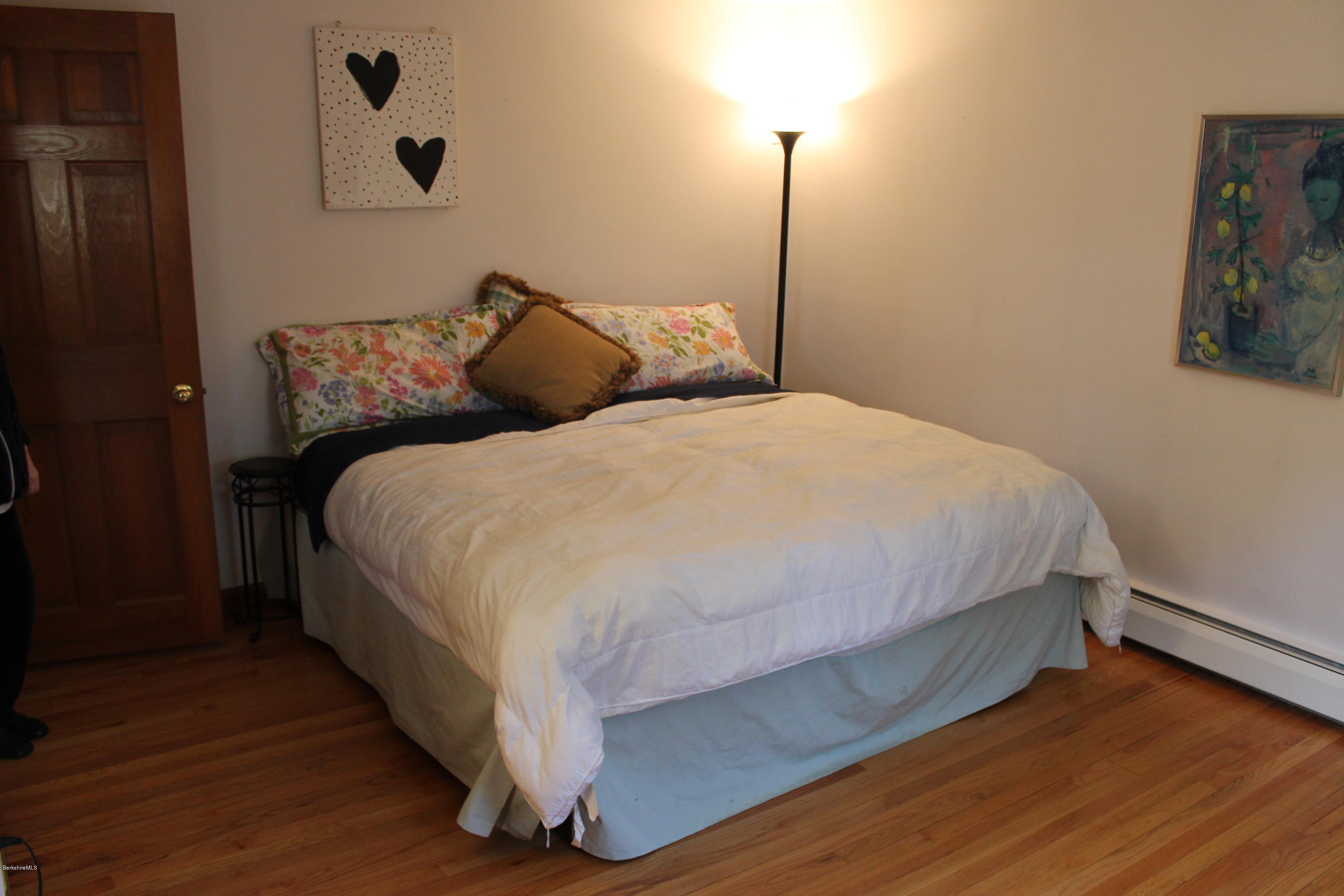 485 Devon Road Lee, MA 01238 - Photo 27 of 28 a bedroom with a bed and a night stand