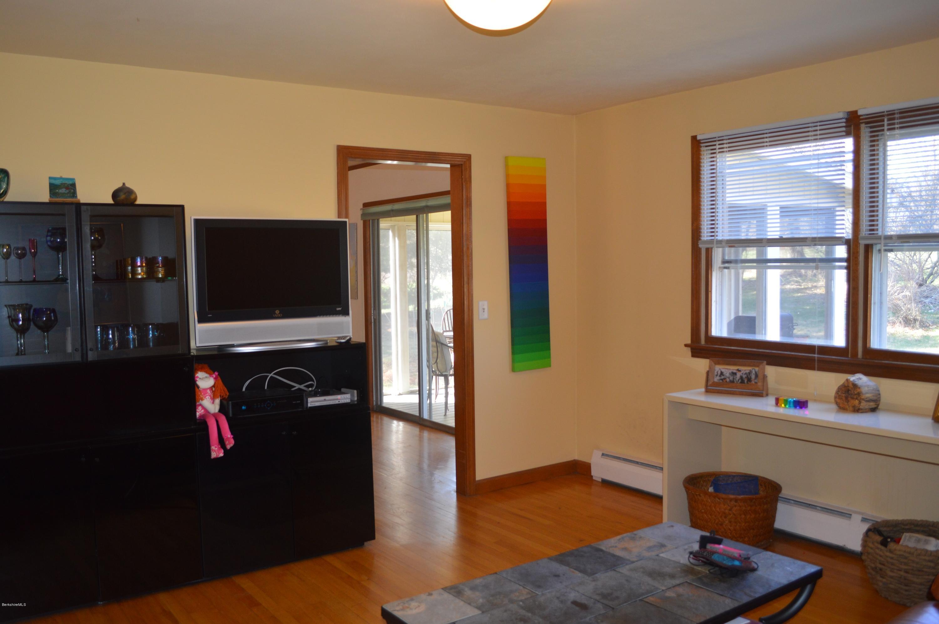 485 Devon Road Lee, MA 01238 - Photo 6 of 28 a living room with furniture and a flat screen tv