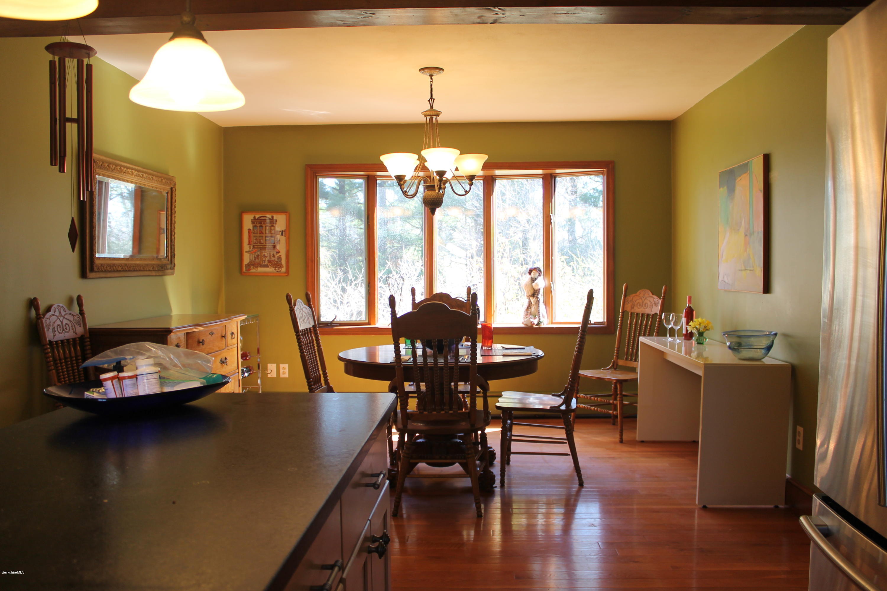 485 Devon Road Lee, MA 01238 - Photo 7 of 28 a view of a dining room with furniture window and wooden floor