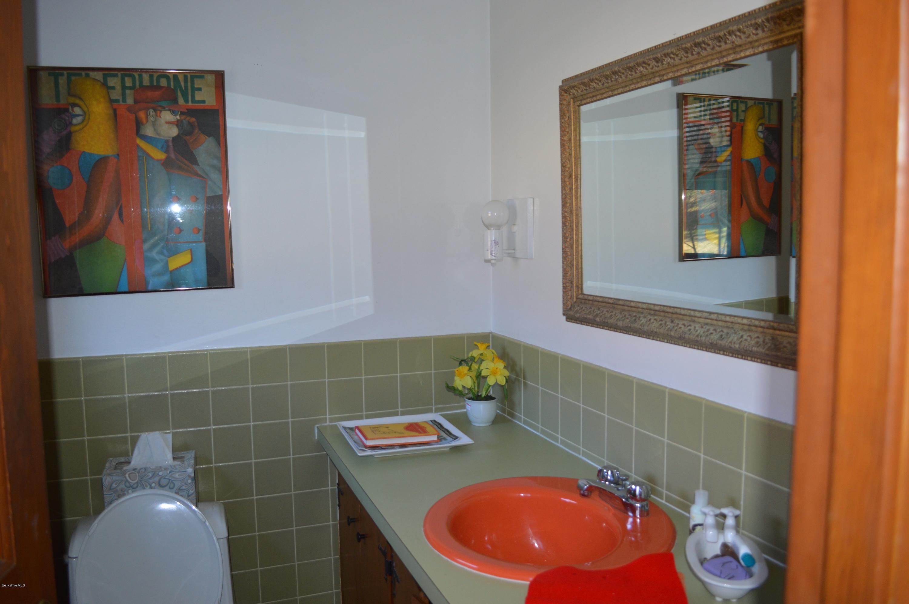 485 Devon Road Lee, MA 01238 - Photo 9 of 28 a bathroom with a sink and mirror