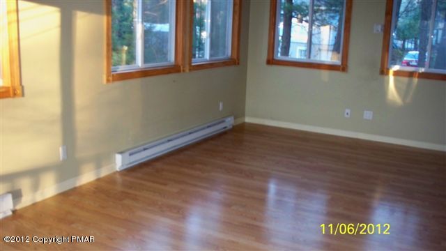 121 Rhododendron Lane Milford, PA 18337 - Photo 4 of 7 a view of an empty room with a window