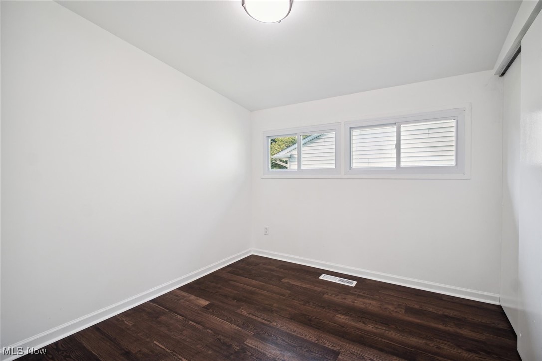 6683 Sherborn Road Cleveland, OH 44130 - Photo 31 of 42 Spare room with vaulted ceiling and hardwood / wood-style floors