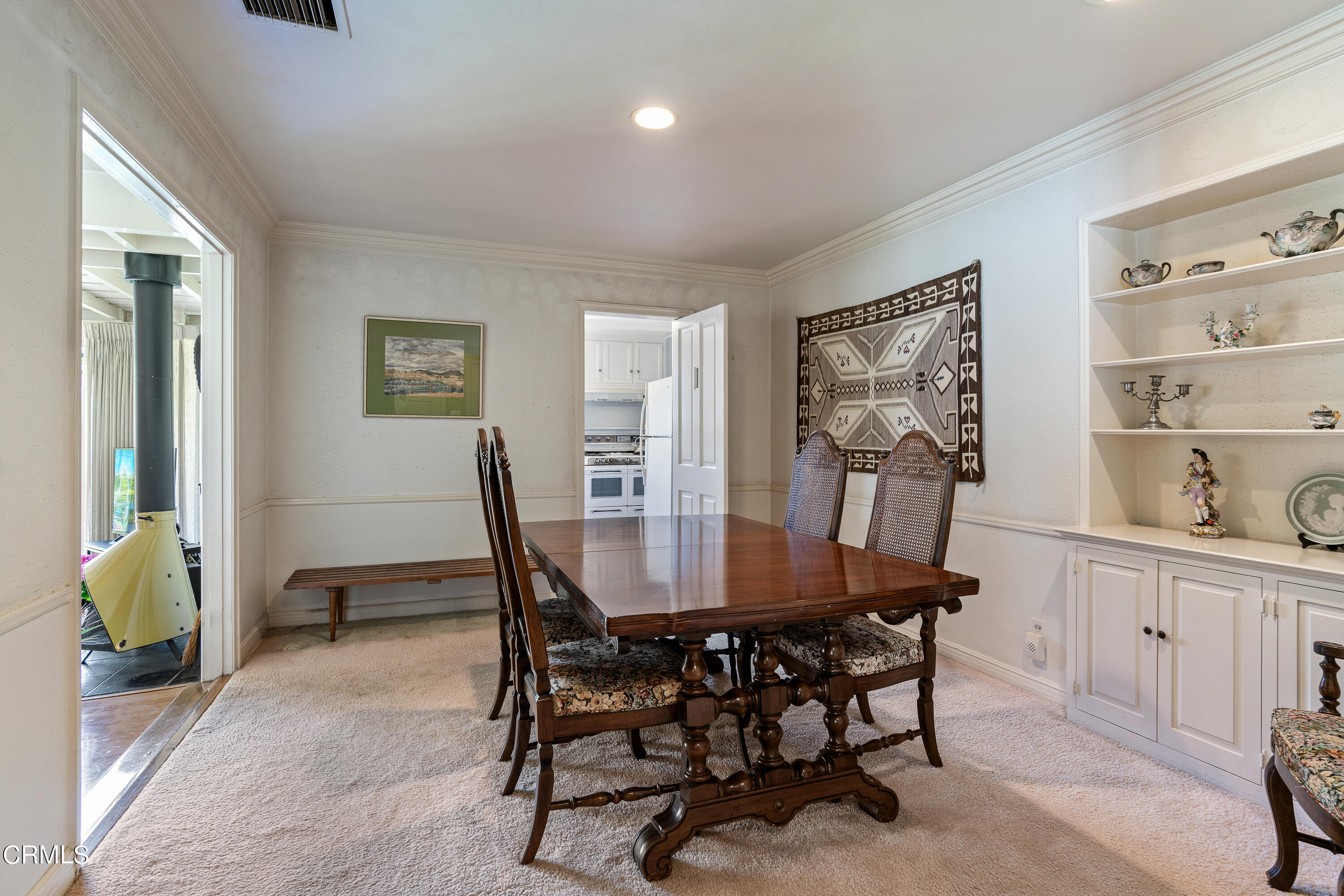 724 Winthrop Road San Marino, CA 91108 - Photo 13 of 37 a view of a dining room with furniture and a potted plant