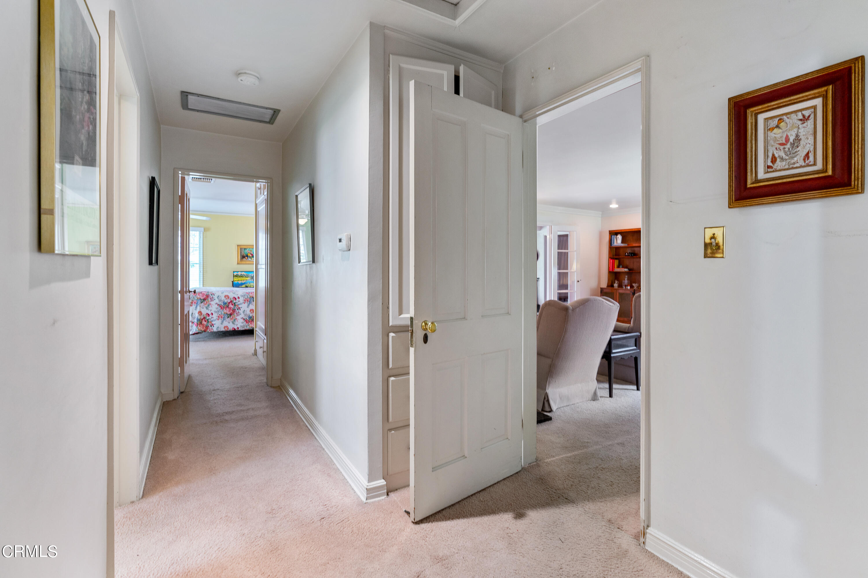 724 Winthrop Road San Marino, CA 91108 - Photo 19 of 37 a view of a hallway with wooden shelves