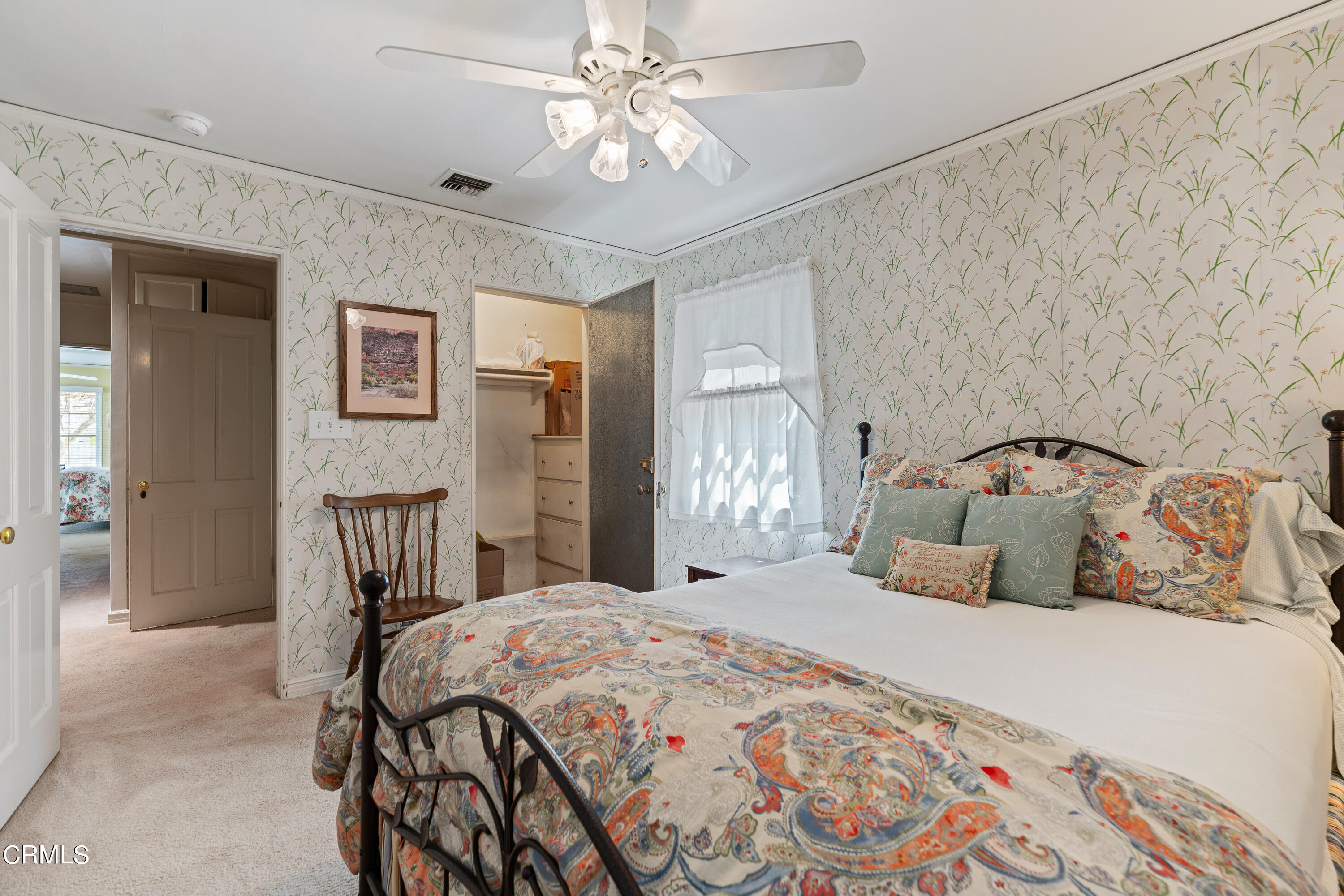 724 Winthrop Road San Marino, CA 91108 - Photo 25 of 37 a bedroom with a bed and a chandelier