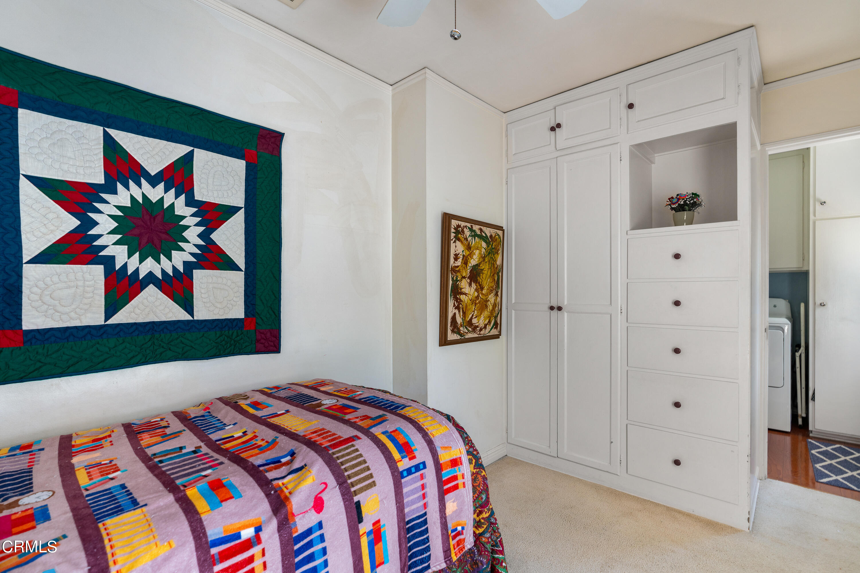 724 Winthrop Road San Marino, CA 91108 - Photo 29 of 37 a bedroom with a bed and painting on the wall