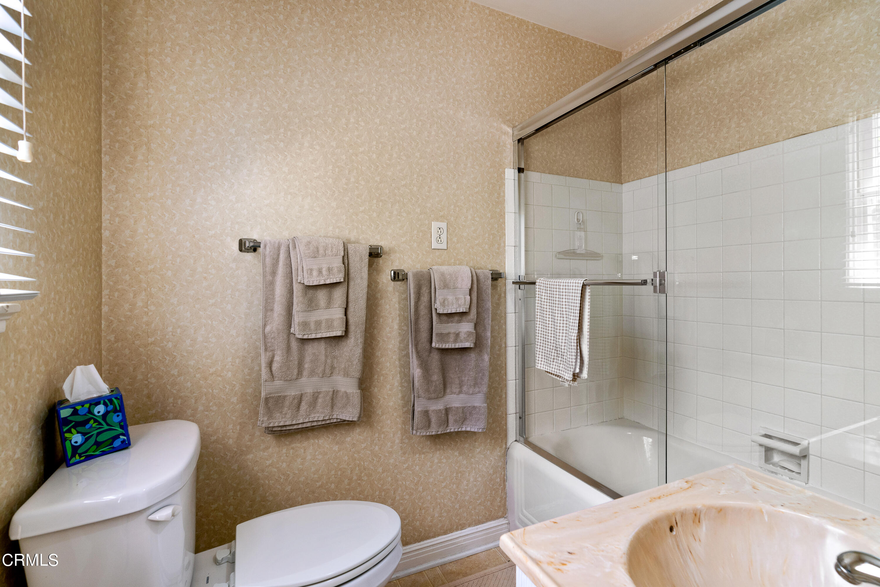 724 Winthrop Road San Marino, CA 91108 - Photo 30 of 37 a white toilet sitting next to a bathroom sink and tub