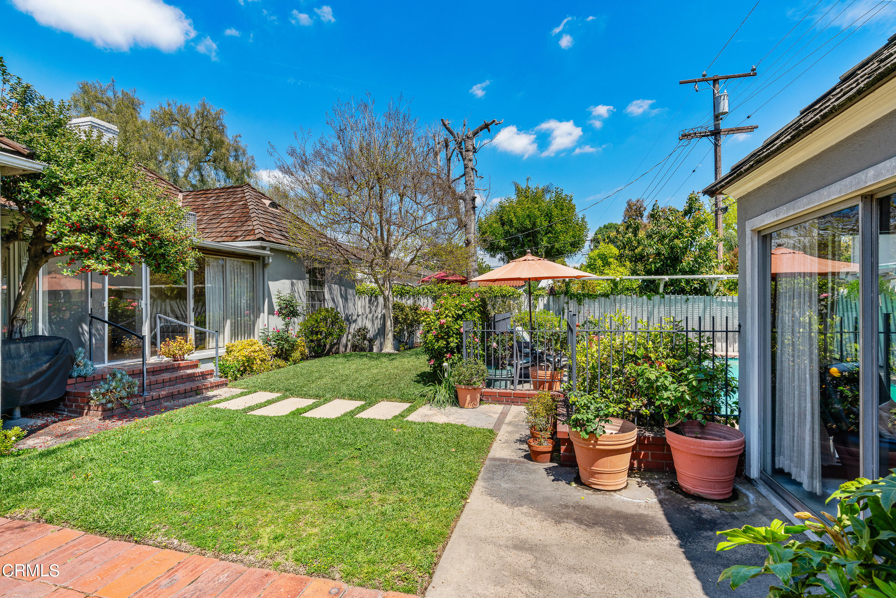 724 Winthrop Road San Marino, CA 91108 - Photo 31 of 37 a view of a house with backyard sitting area and garden