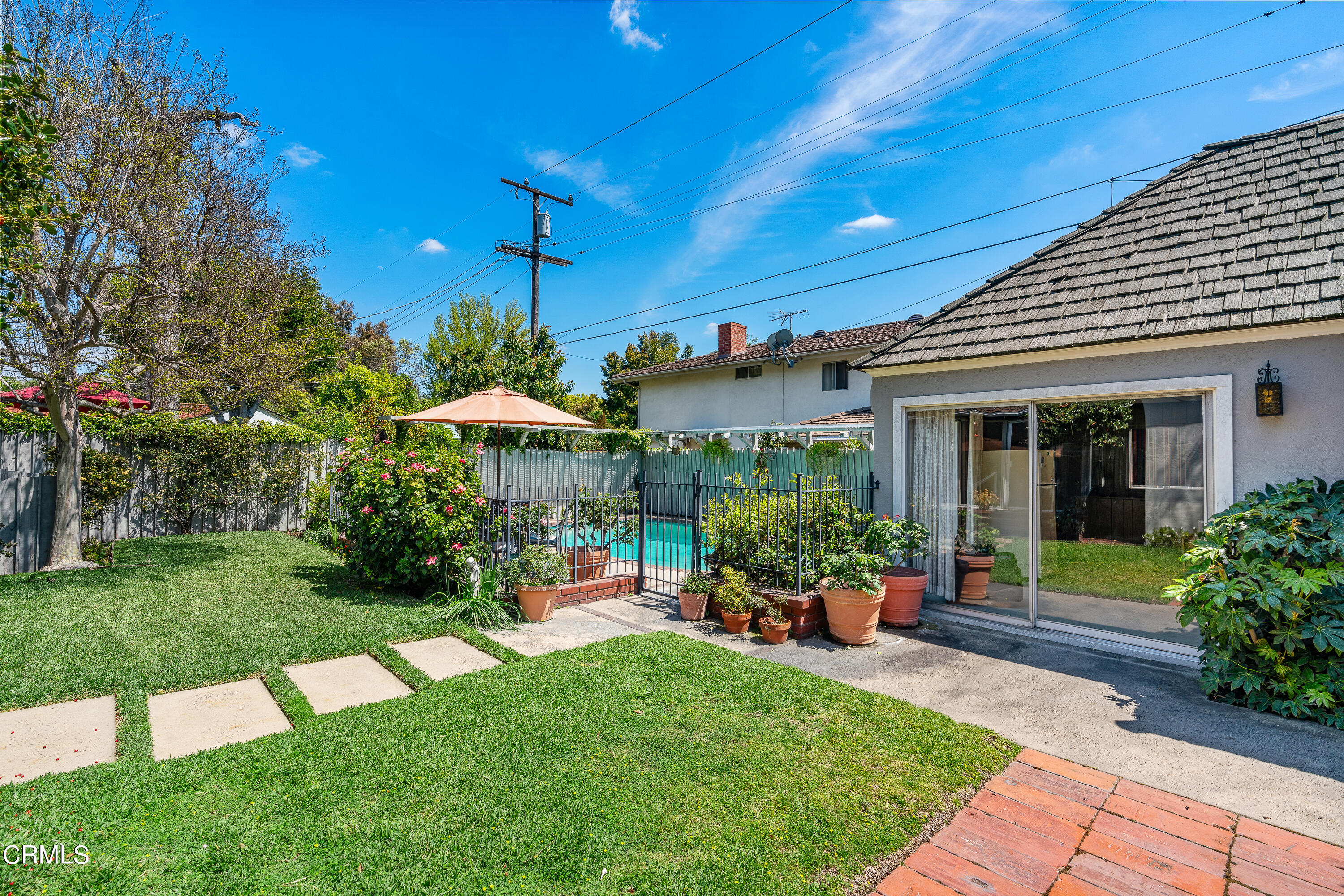 724 Winthrop Road San Marino, CA 91108 - Photo 32 of 37 a front view of a house with a yard garden and outdoor seating