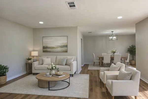 a living room with furniture and a table