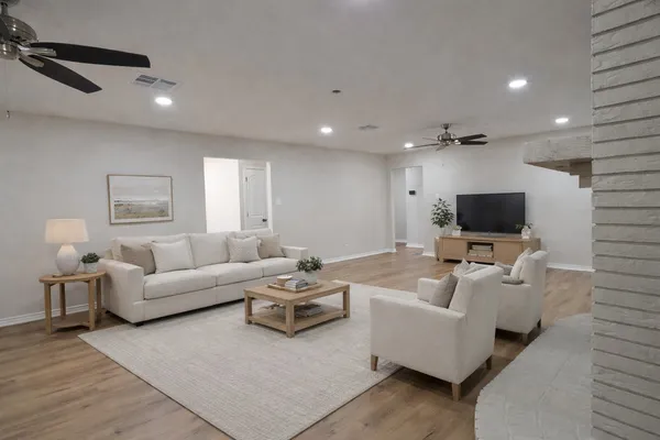 a living room with furniture and a flat screen tv