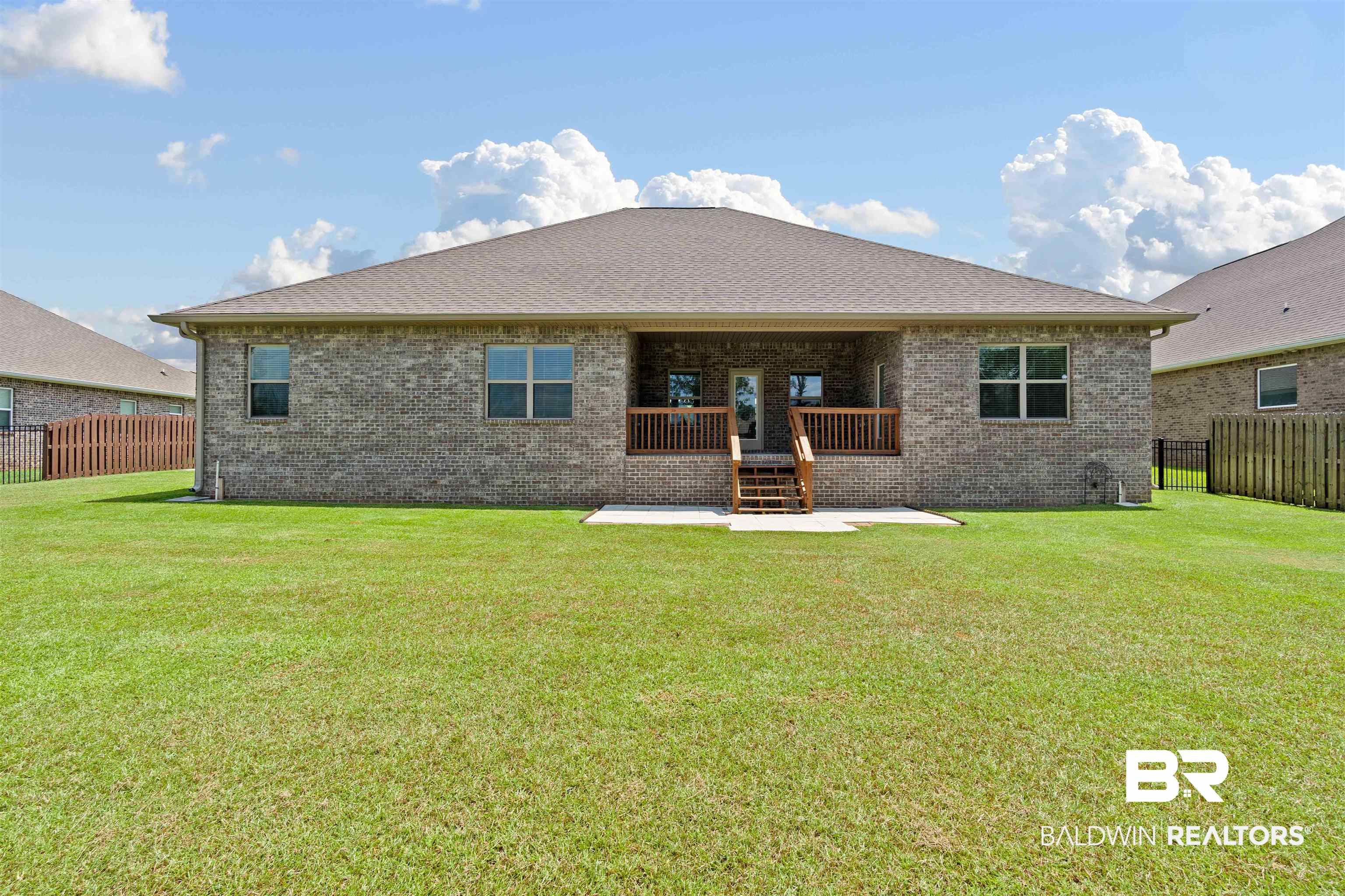 1864 Gwin Court Mobile, AL 36695 - Photo 32 of 37 Back of house with a patio area and a yard