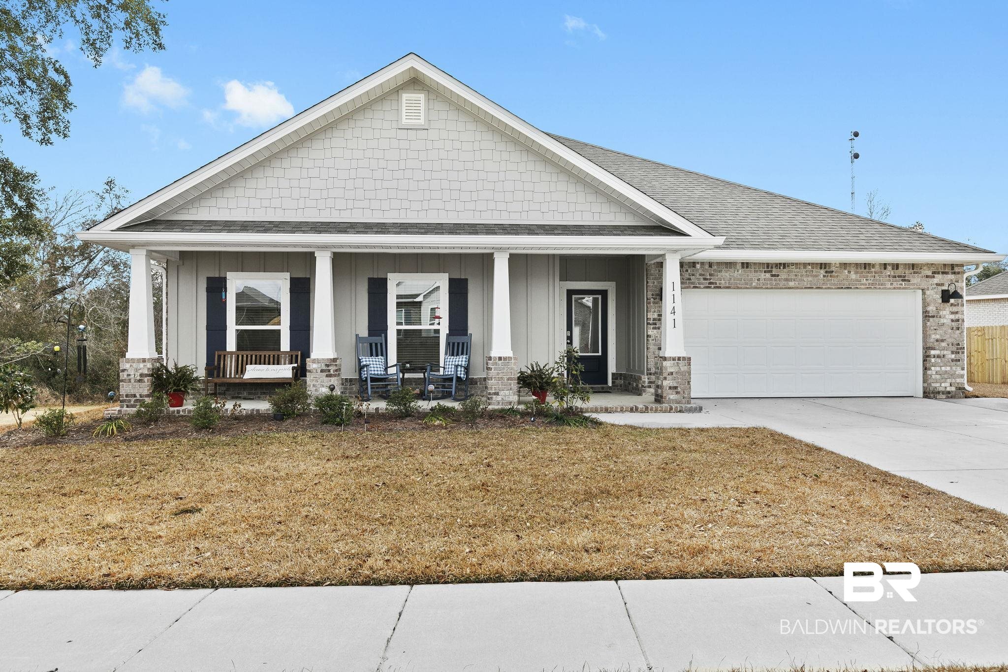1141 Pencarro Boulevard Foley, AL 36535 - Photo 4 of 70 Craftsman-style home featuring a garage, covered porch, and a front lawn