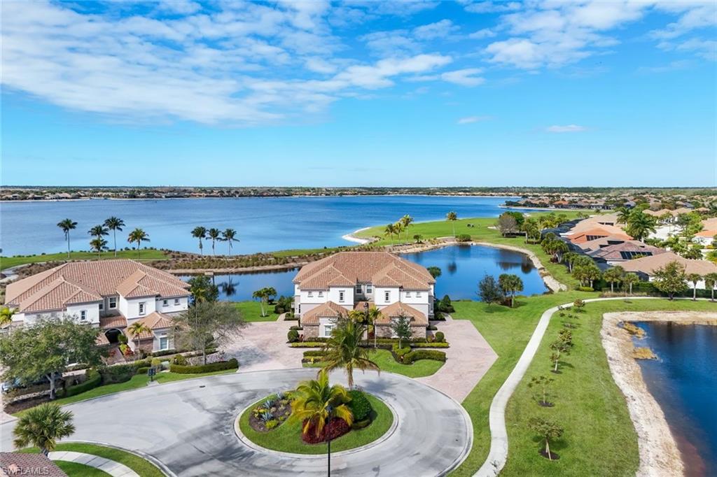 9060 Siesta Bay Drive, Unit 101 Naples, FL 34120 - Photo 1 of 49 an aerial view of residential houses with outdoor space and swimming pool