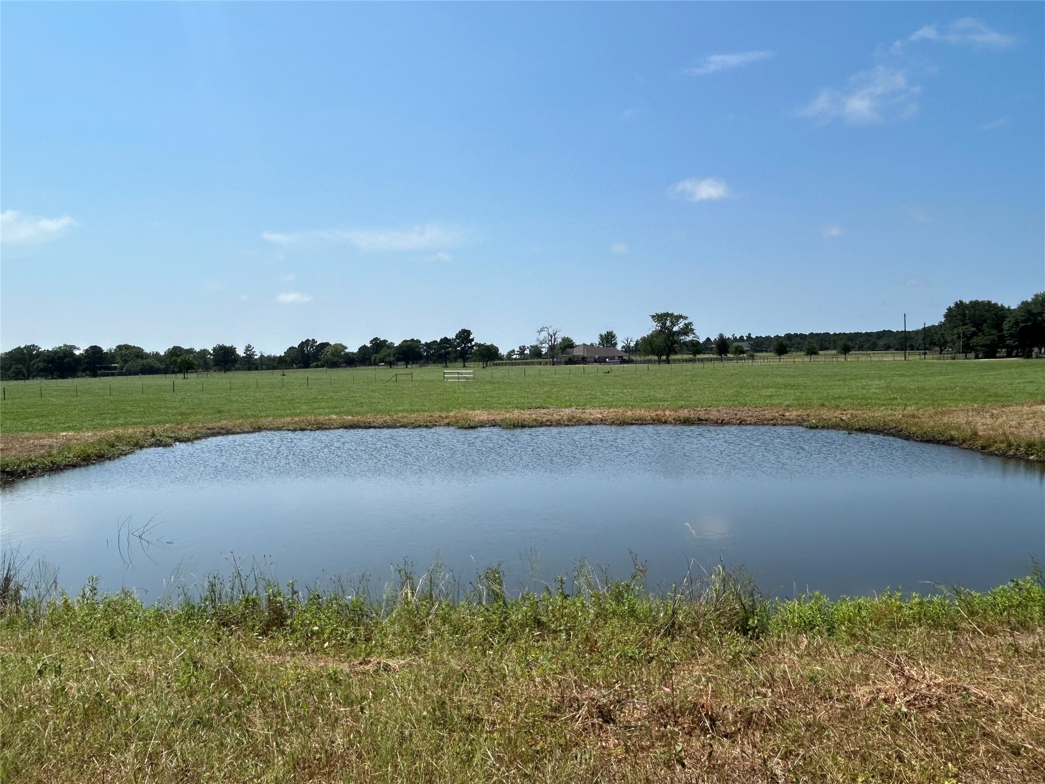 38535 Wiggins Road Hempstead, TX 77445 - Photo 7 of 24 an aerial view of a golf course with a lake view