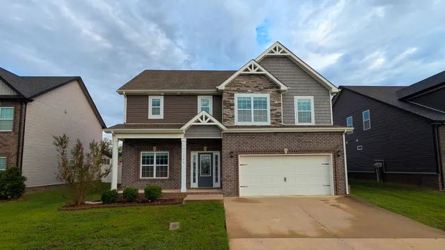 front view of a house with a yard