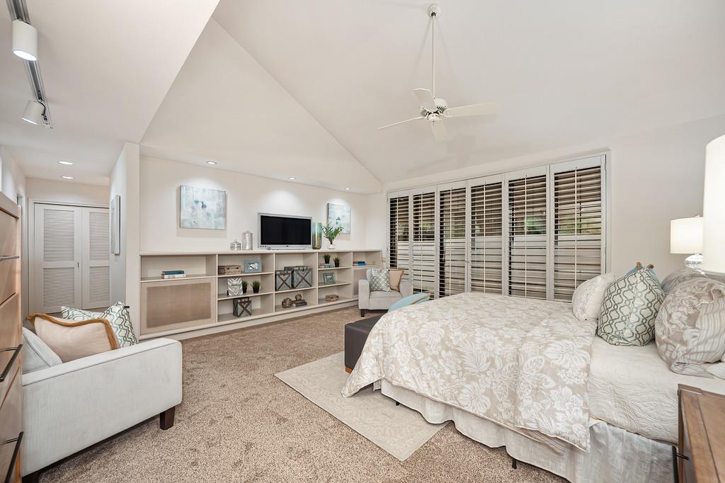 7650 Pineridge Road Fair Oaks, CA 95628 - Photo 24 of 67 a bedroom with a bed a flat screen tv and balcony view